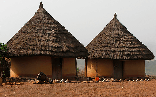 Houses-and-djembe Houses and djembe in Guinea